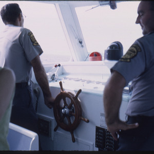 Boat captains steering ship, circa September 1967