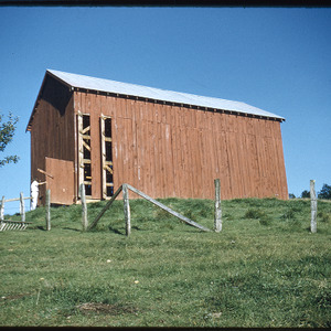 Red barn in field, circa September 1969