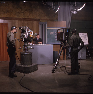 Camera operators and news anchor Hal Reynolds filming WUNC-TV segment, circa November 1963