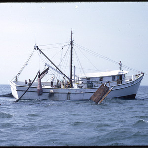 Fishing boat sailing on water, circa September 1967