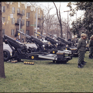 Men posing with cannons, circa April 1973