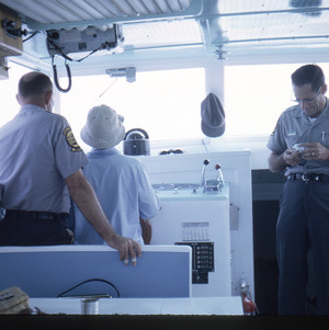 Boat captains and passenger, circa September 1967