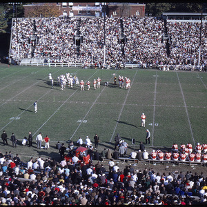 Football players in Riddick Stadium at game, circa November 1964