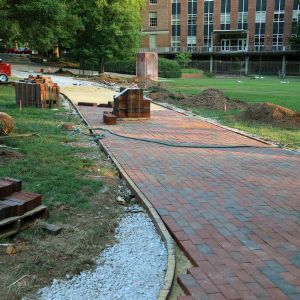 Construction of brick pathway near D. H. Hill