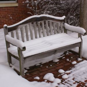 Snow on bench near Library
