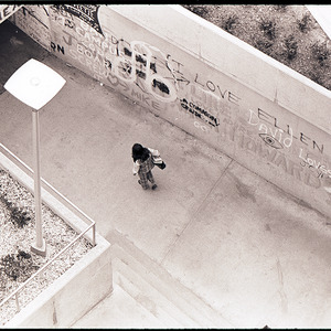 Person walking in Free Expression Tunnel, circa 1969-1975