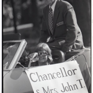 Dr. John T. Caldwell and Mrs. Carol Caldwell driving in parade, 1973