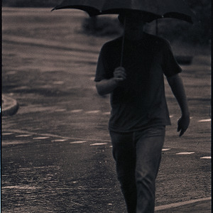 Students in the rain, circa 1969-1975