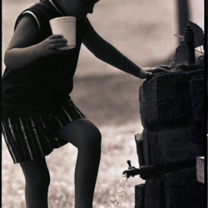 Child with drink, circa 1969-1975