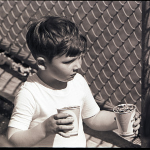 Child with drink, circa 1969-1975