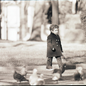 Child with pigeons, circa 1969-1975