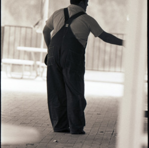 Man in overalls, circa 1969-1975