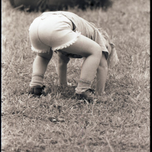 Child on grass, circa 1969-1975