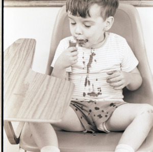 Child with ice cream, circa 1969-1975