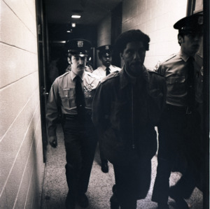Army officers walking down a hallway, circa 1969-1975
