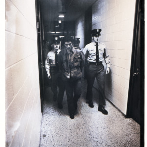 Army officers walking down a hallway, circa 1969-1975
