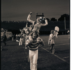 Wolfpack Cheerleaders on football field, circa 1969-1975