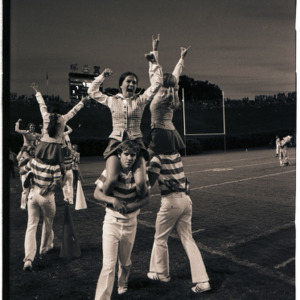 Wolfpack Cheerleaders on football field, circa 1969-1975