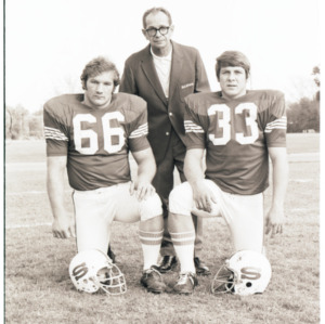 Coach Al Michaels and football players portrait, circa 1969-1975