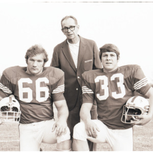 Coach Al Michaels and football players portrait, circa 1969-1975