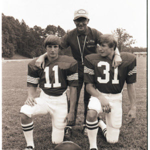 Coach Lou Holtz and football players portrait, circa 1969-1975