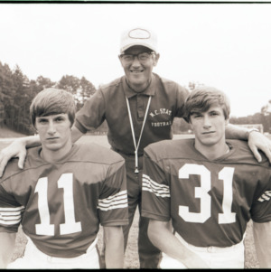 Coach Lou Holtz and football players portrait, circa 1969-1975