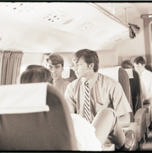 Football players on a plane, circa 1969-1975
