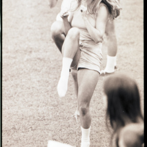 Women exercising on field, 1973