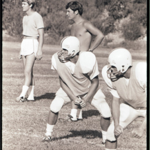Football players at practice, circa 1969-1975