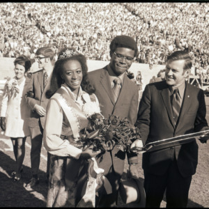 Homecoming Queen Mary Evelyn Porterfield with escort Michael Brown and Alumni Affairs Director Bryce Younts, 1970