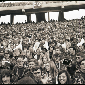 Marching band and spectators in stands, 1969
