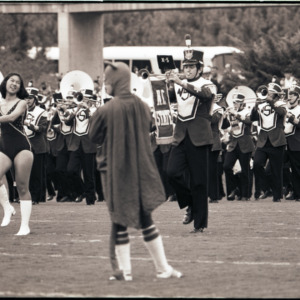 Duke mascot and marching band at football game, circa 1969-1975
