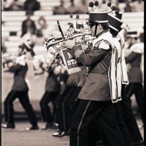 Marching band at football game, circa 1969-1975