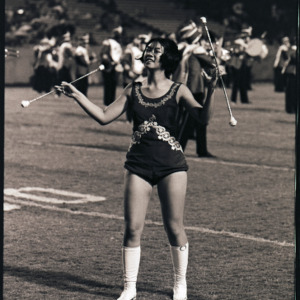 Majorette at football game, circa 1969-1975