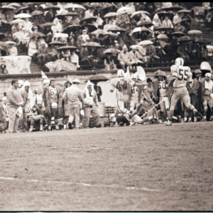 Football players and coaching staff at NC State versus Duke game, circa 1969-1975