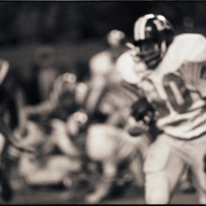 Football players at NC State versus East Carolina game, circa 1969-1975