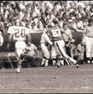 Football players and referee at NC State versus Georgia game, 1973
