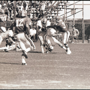 Football players and spectators at NC State versus Georgia game, 1973