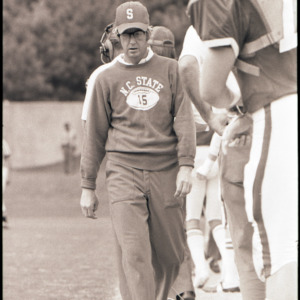 Football coaches and player at NC State versus Indiana game, October 4, 1975