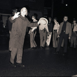 John Caldwell with police officers at celebration after victory over UCLA, March 23, 1974
