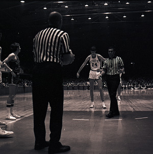Basketball players and referees at NC State vs. Atlantic Christian, circa 1969-1975