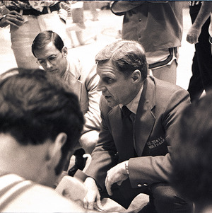 Basketball players around Norm Sloan at NC State vs. Clemson, circa 1969 -1975