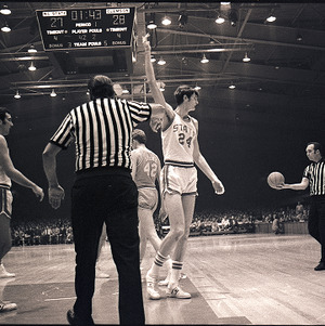 Basketball players and referees at NC State vs. Clemson, circa 1969-1975