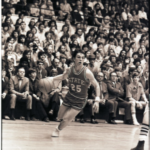 Basketball player and spectators at NC State versus Duke game, circa 1972-1975