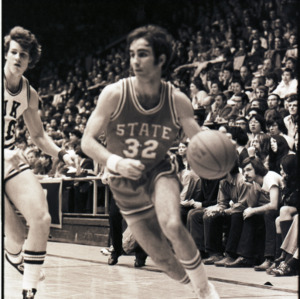 Basketball players and spectators at NC State versus Duke game, circa 1972-1975