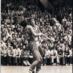 Basketball players and spectators at NC State versus Duke game, circa 1972-1975