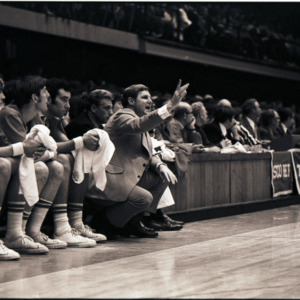 Basketball coach Norm Sloan and players at NC State versus East Carolina game, circa 1973-1974