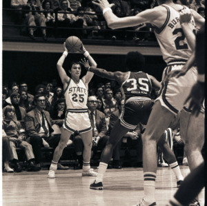 Basketball players and spectators at NC State versus East Carolina game, circa 1972-1975