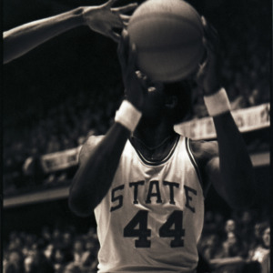 Basketball player at NC State versus East Carolina game, circa 1972-1975