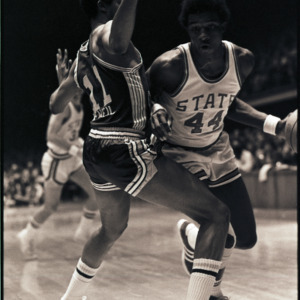 Basketball players at NC State versus East Carolina game, circa 1972-1975